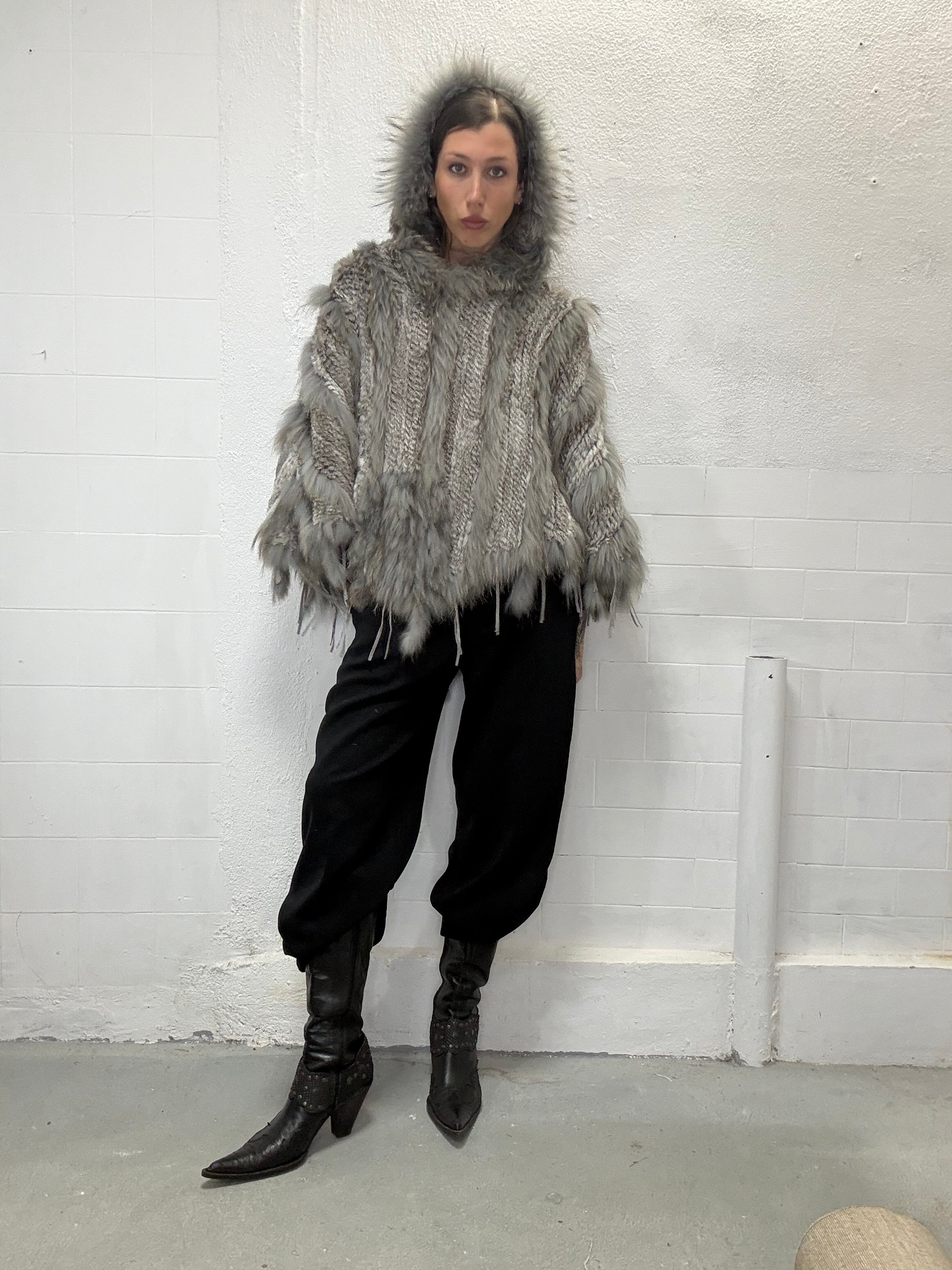 Oversized real fur poncho with hood shown on model