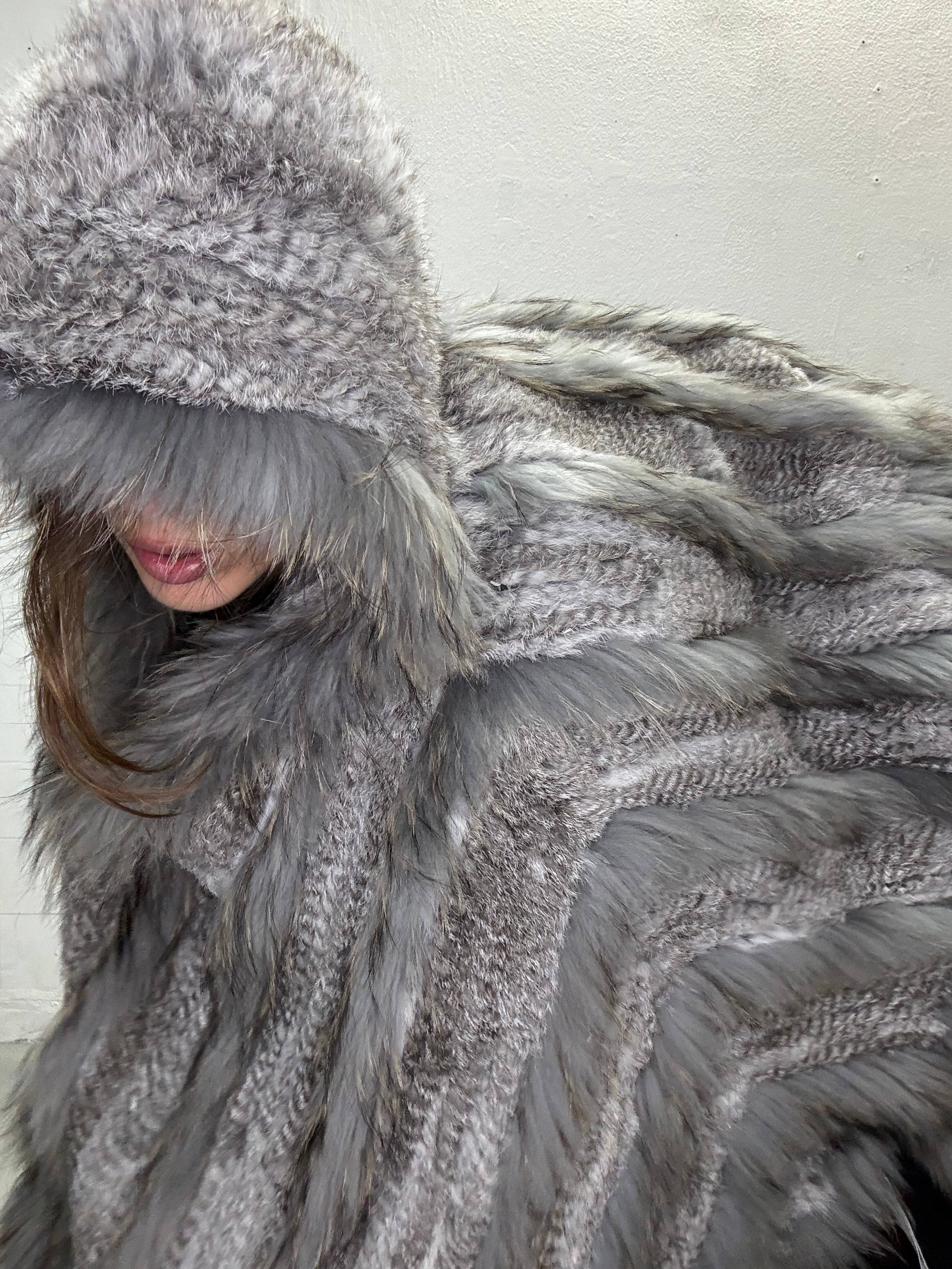 Close up of real fur poncho texture and layered construction