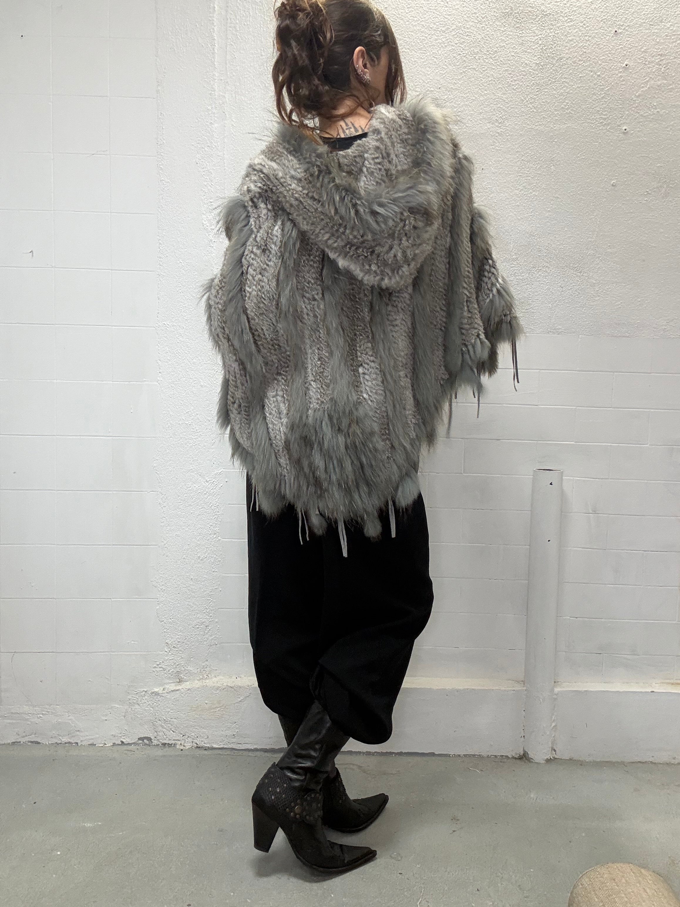 Editorial styling of hooded real fur poncho