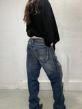 Vintage distressed Lee jeans worn by model