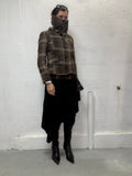 High neck brown and beige check coat worn by model