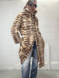 Long real fur coat worn with denim
