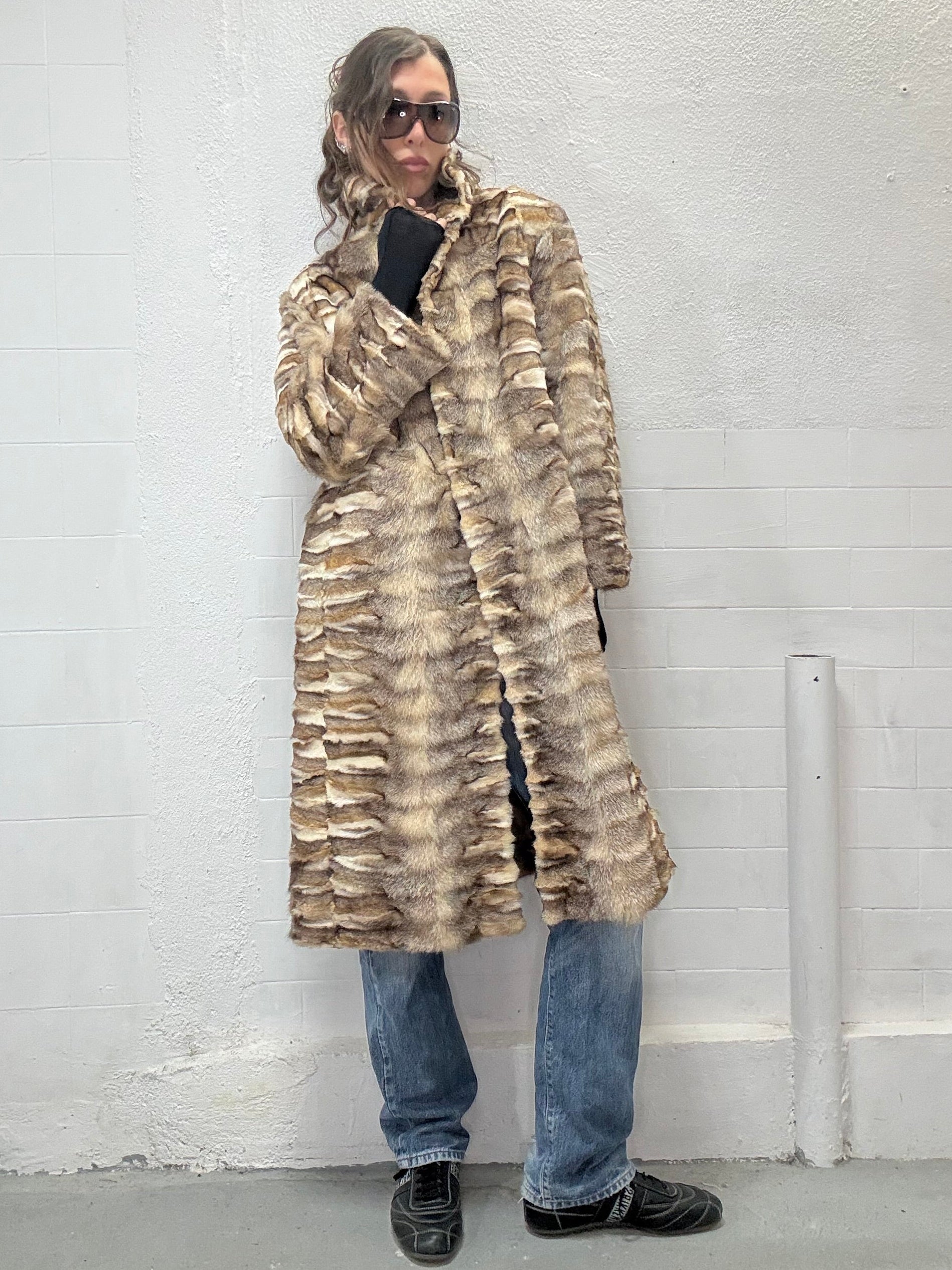 Long real fur coat styled with jeans