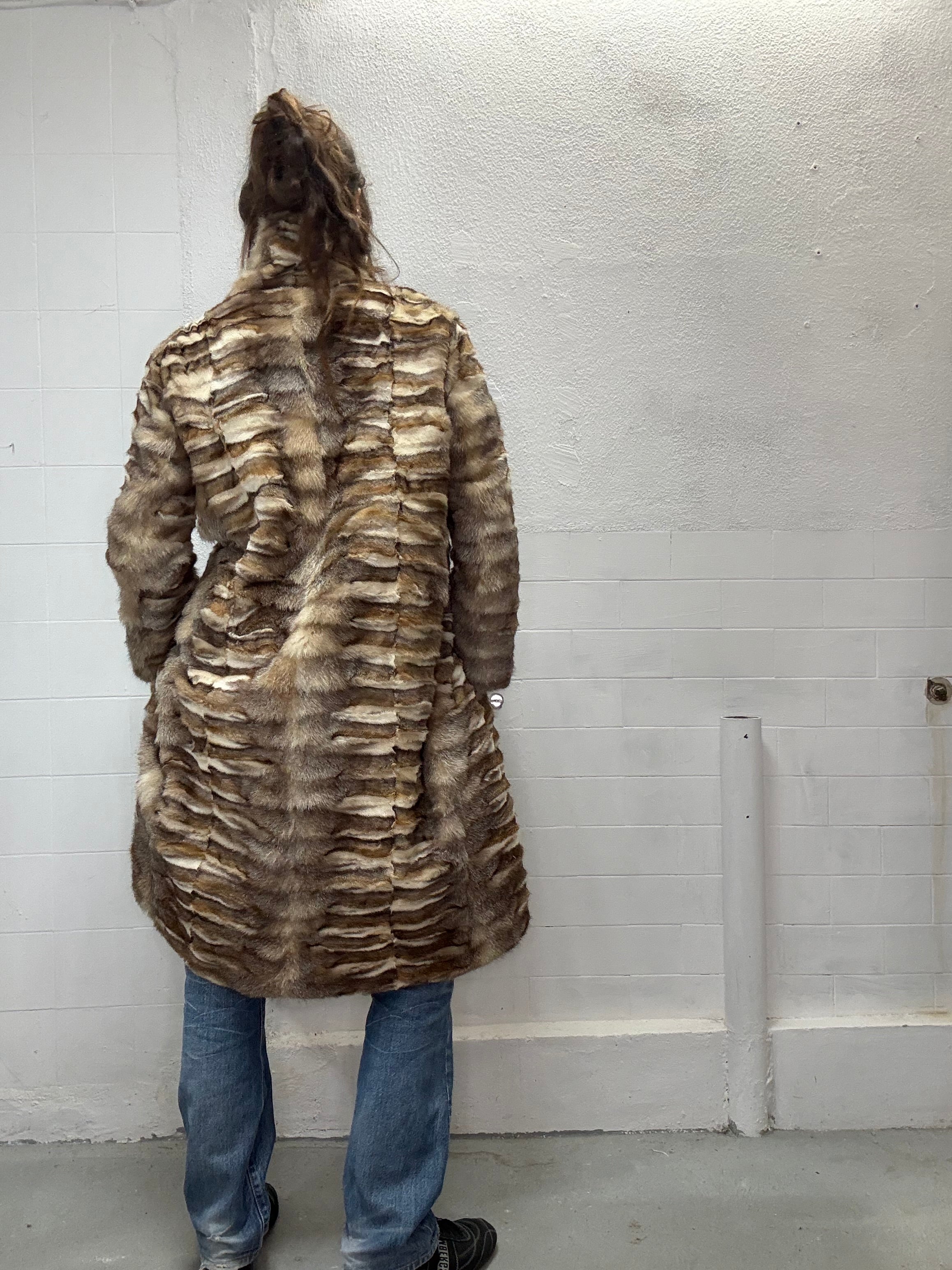 Long fur coat photographed indoors
back view