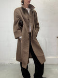 Vintage long brown wool coat worn by model