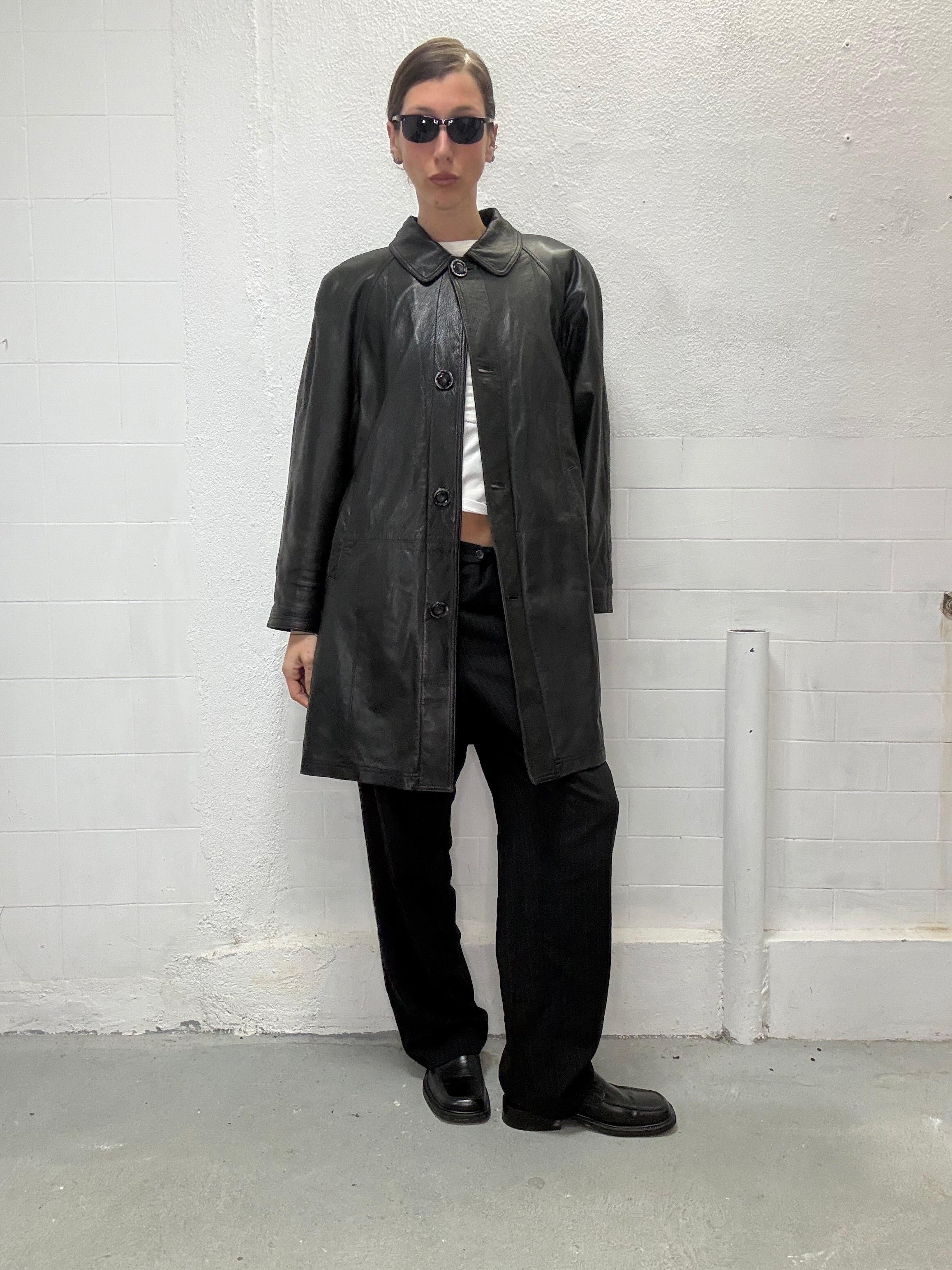 Vintage black leather outerwear worn by model