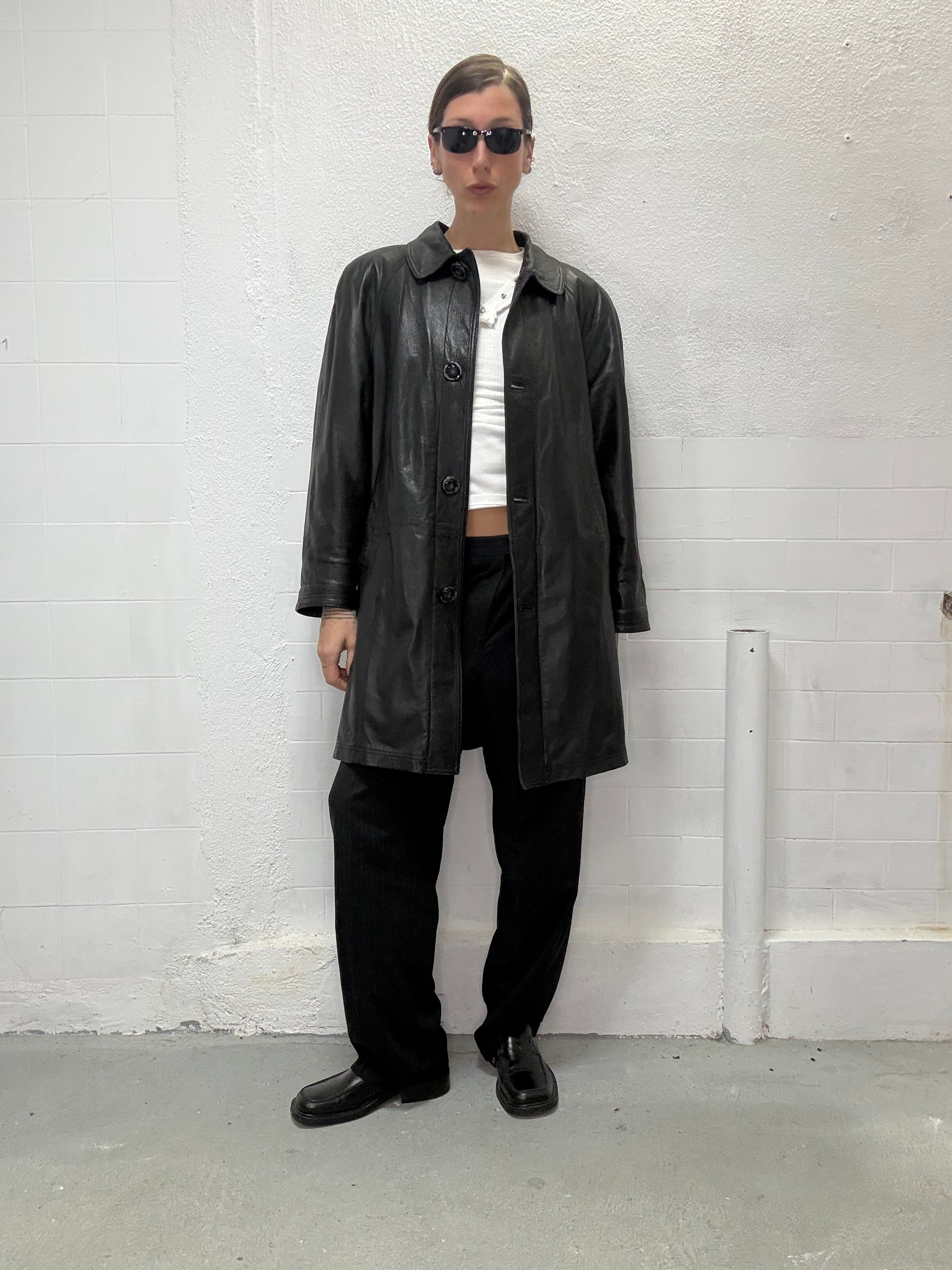 Black leather coat with button closure